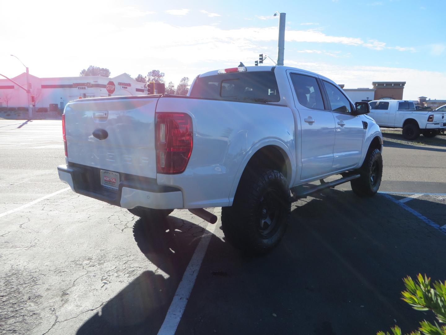 2019 White /Black Ford Ranger Lariat (1FTER4FHXKL) with an 2.3L engine, automatic transmission, located at 2630 Grass Valley Highway, Auburn, CA, 95603, (530) 508-5100, 38.937893, -121.095482 - Features a Fabtech suspension system, Fuel Offroad wheels, Nitto Ridge Grappler tires, Westin Running boards, and a Bakflip. - Photo#4